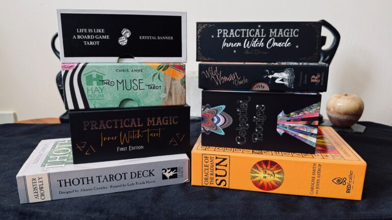 Picture of 4 Tarot Decks on left side and 4 Oracle decks on the right side